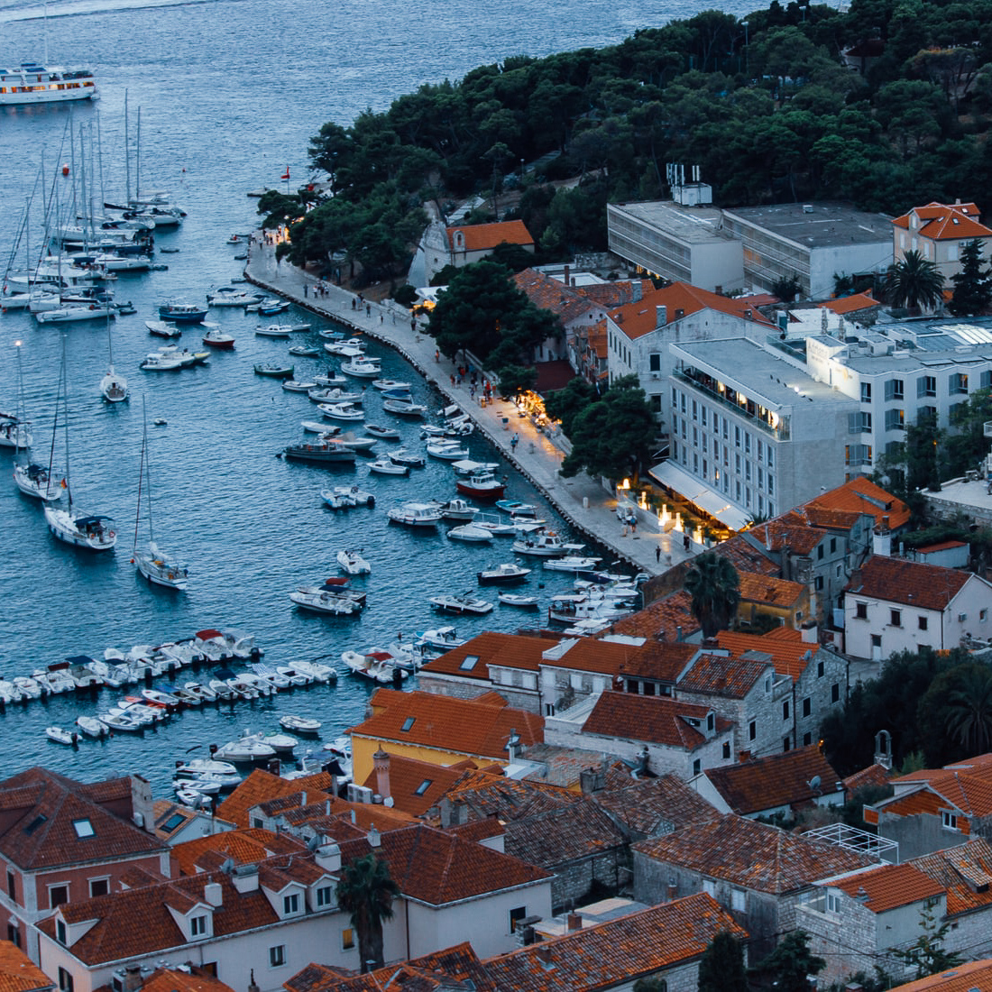 Marina filled with boats next to old Croatian buildings