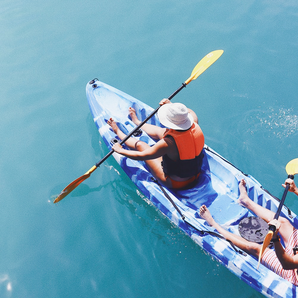 Two people on a kayak in the ocean